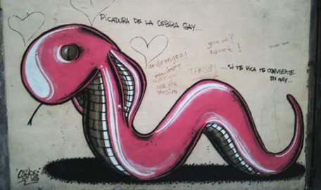 Homosexuality. Graffiti of a cobra snake painted pink with the text "The bite of the gay cobra … if it bites you it makes you gay"